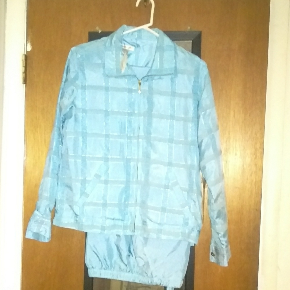 Silk blue track suit.